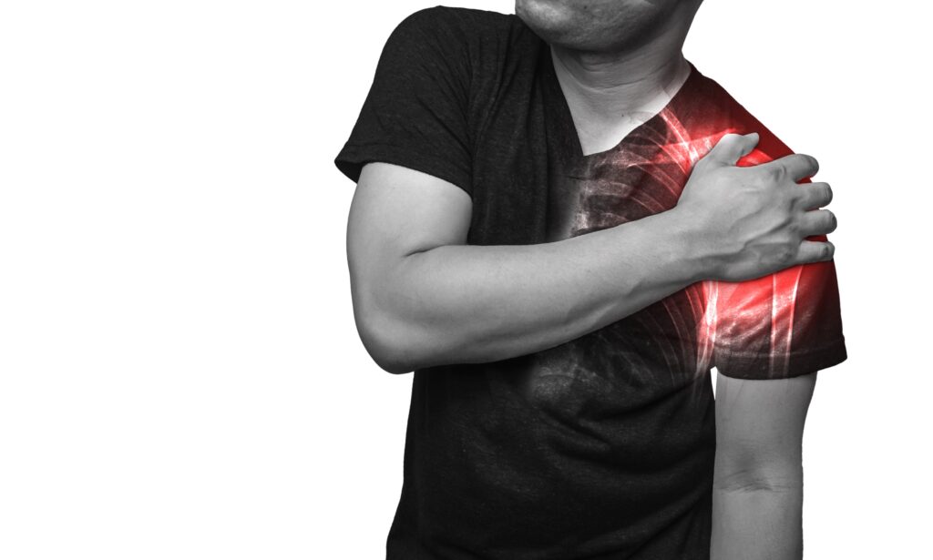 close,up,a,man,holding,his,injured,shoulder,pain,,broken